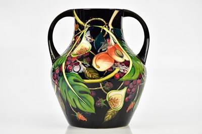 Lot 2232 - EMMA BOSSONS FOR MOORCROFT; a twin handled...