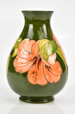 Lot 2336 - MOORCROFT; a baluster shaped vase in the...