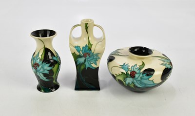 Lot 2237 - ERIC KALS FOR MOORCROFT; three vases decorated...