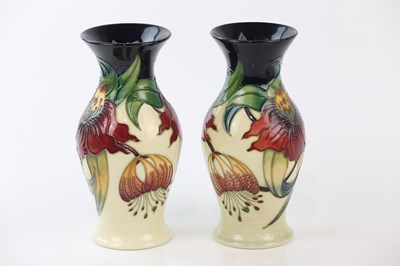 Lot 2276 - MOORCROFT; a pair of ovoid vases with flared...