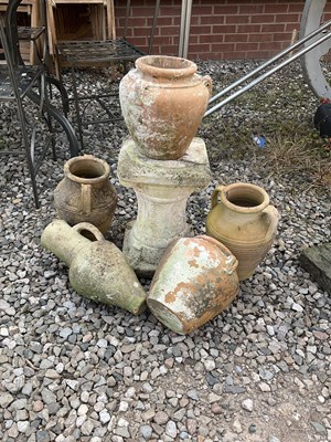 Lot 609 - A quantity of terracotta garden pots, urns and...