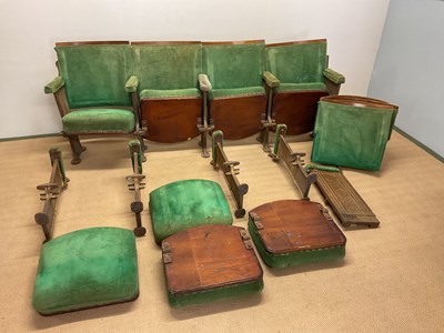 Lot 653 - Two rows of four cinema seats with cast iron...