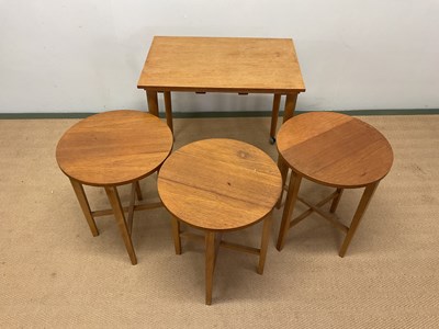 Lot 695 - A mid century Danish nest of tables, the teak...
