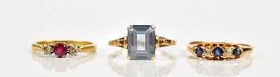 Lot 2405 - An 18ct yellow gold diamond and sapphire three...