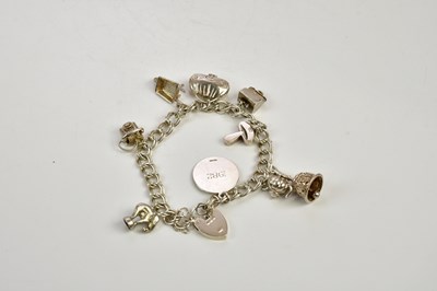 Lot 487 - A silver charm bracelet, approx 42.3g.