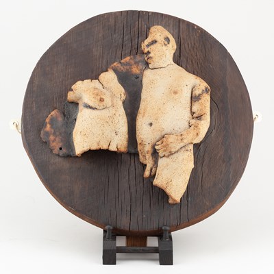 Lot 689 - A stoneware wall sculpture of a naked couple...