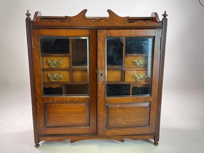 Lot 656 - A Victorian oak smoker's cabinet with double...