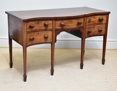 Lot 81 - A late George III serpentine mahogany...