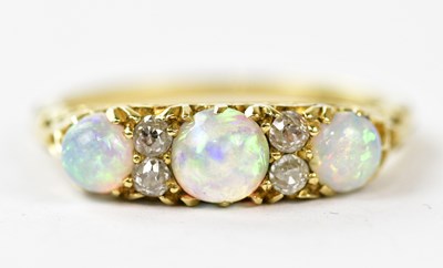 Lot 2402 - A Victorian yellow metal opal and diamond set...