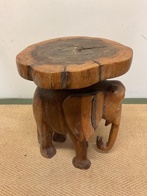 Lot 703 - A carved wooden elephant stand, height 39cm,...