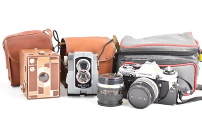 Lot 590 - Two vintage Box Brownie cameras in carry cases,...