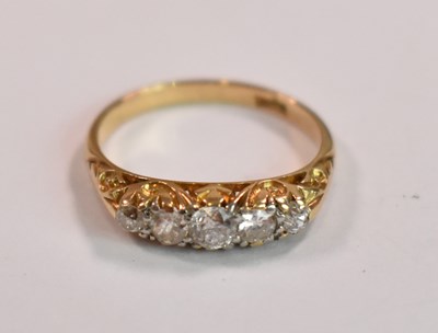 Lot 395 - An 18ct yellow gold five stone graduated...