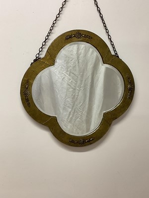 Lot 670 - An Arts and Crafts mirror of quatrefoil form...