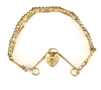 Lot 1047 - A 9ct gold four-bar gate bracelet with 9ct...
