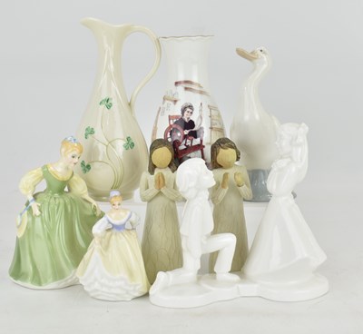 Lot 208 - A collection of porcelain figures comprising...