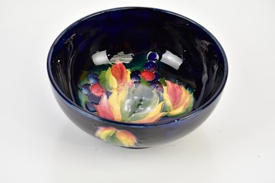 Lot 2334 - WALTER MOORCROFT; a footed bowl decorated in...