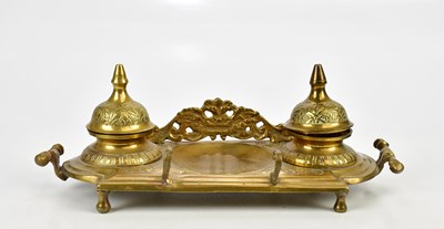 Lot 1613 - A brass ink stand with two covered inkwells,...