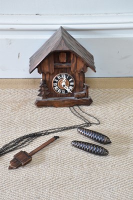 Lot 1424 - A reproduction cuckoo clock with black dial...