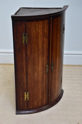 Lot 1337 - A Georgian oak bowfronted wall hanging corner...