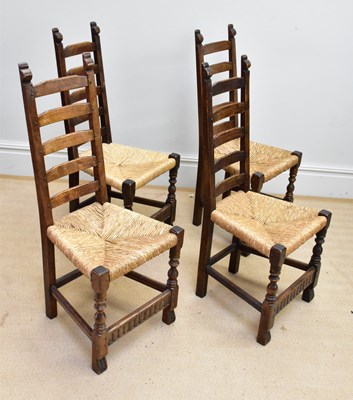 Lot 1338 - A set of four 19th century ladder back rush...