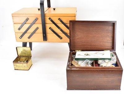 Lot 480 - A vintage concertina sewing box containing...