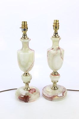 Lot 1807 - A pair of onyx table lamps, height including...