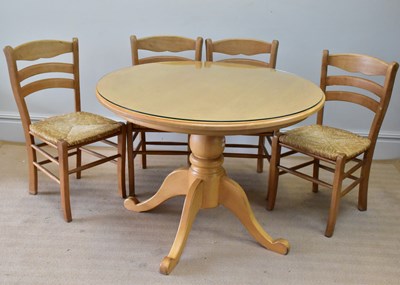 Lot 273 - A modern kitchen table with four rush seated...
