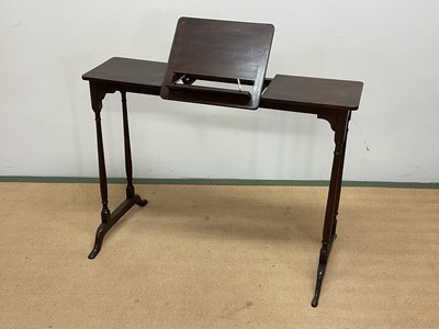 Lot 701 - A mahogany rise and fall music table, height...