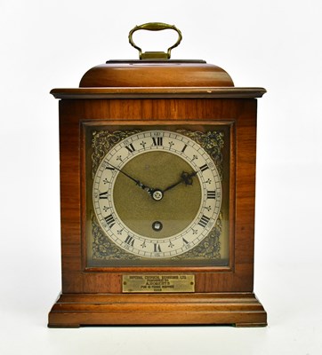 Lot 1442 - A 1940s walnut cased bracket clock with brass...