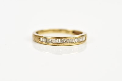 Lot 2403 - A 9ct gold and diamond set half eternity ring,...