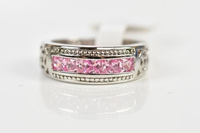 Lot 2418 - A silver and pink sapphire set half eternity...