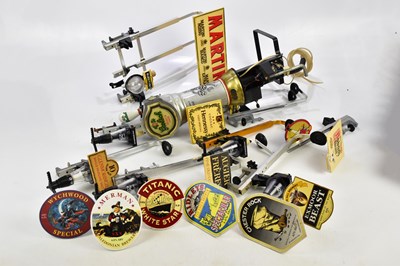 Lot 1576 - A collection of breweriana including pumps,...