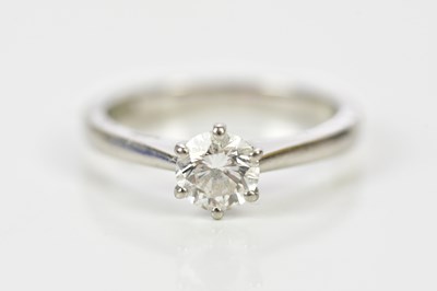 Lot 70 - A platinum and diamond solitaire ring, the six...