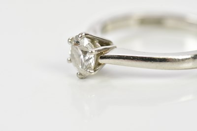 Lot 27 - A platinum and diamond solitaire ring, the six...