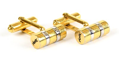 Lot 764 - YVES SAINT LAURENT; a pair of gold and silver...