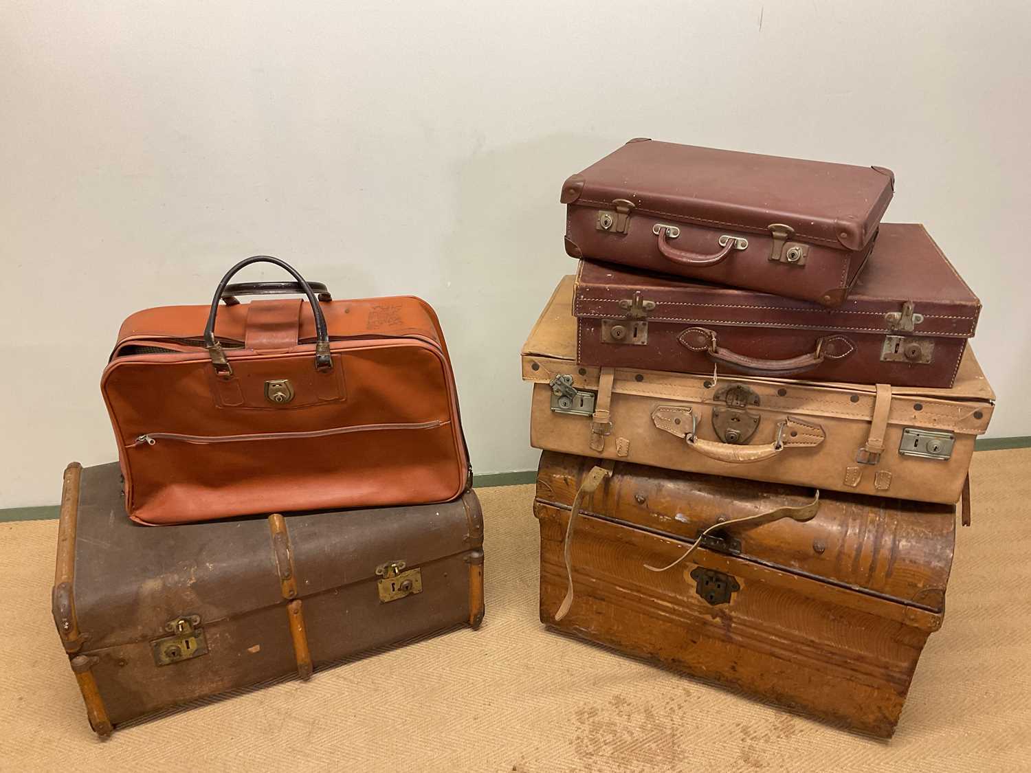 Lot 93 - A tin domed trunk, a slat bound trunk, a case...