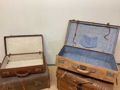 Lot 93 - A tin domed trunk, a slat bound trunk, a case...