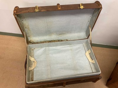 Lot 93 - A tin domed trunk, a slat bound trunk, a case...