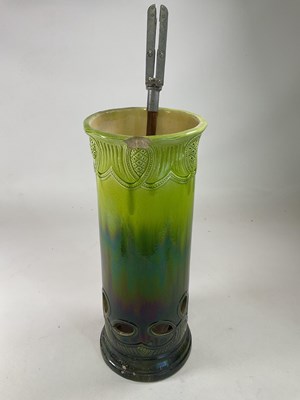 Lot 274 - BURMANTOFTS; a green glazed stick stand,...