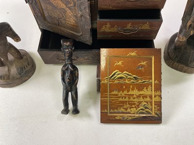 Lot 15 - A Japanese table top cabinet and three wooden...