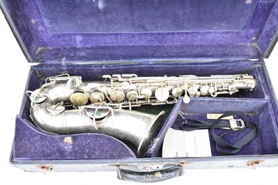 Lot 1119 - THE BUESCHER; a silver plated alto saxophone,...