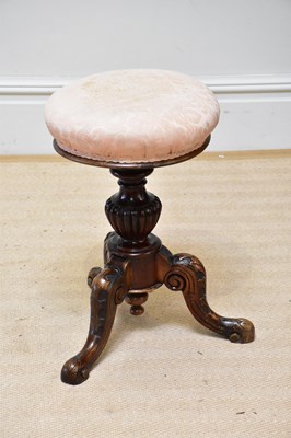 Lot 1334 - A Victorian carved walnut piano stool with out...