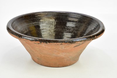 Lot 1574 - A 19th century earthenware dairy bowl with...
