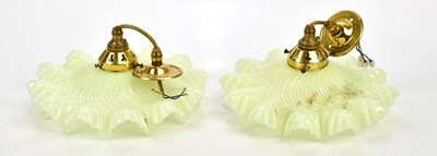Lot 1785 - A pair of French green glass opaline suspended...