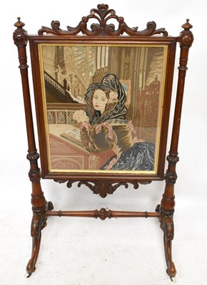 Lot 1668 - A Victorian walnut framed firescreen, inset...