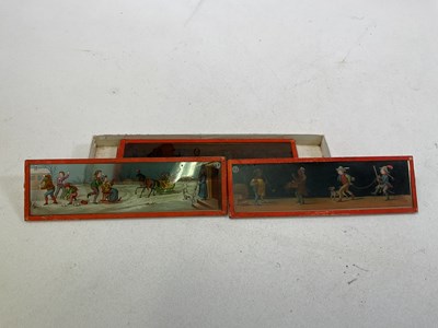 Lot 5 - Four magic lanterns in metal cases with a box...