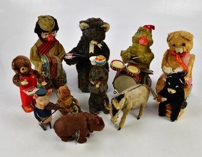 Lot 246 - A collection of wind-up toys including a...