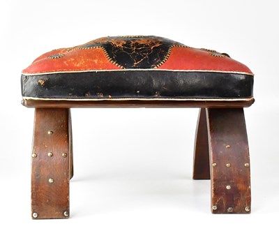 Lot 371 - A leather seated camel stool with wooden frame,...