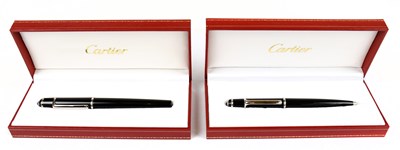 Lot 729 - CARTIER; a black Diabolo de Cartier fountain...