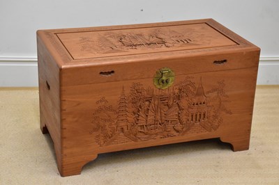 Lot 1184 - A Chinese carved camphorwood blanket box,...